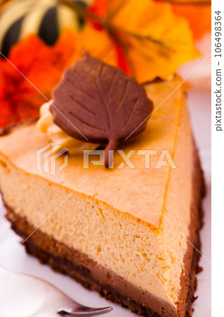 Pumpkin white chocolate cheesecake for Thanksgiving. 106498364
