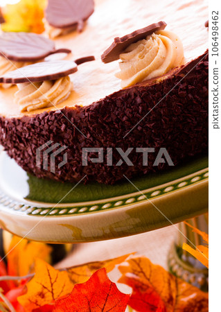 Pumpkin white chocolate cheesecake for Thanksgiving. Pumpkin white chocolate cheesecake for Thanksgiving. 106498462