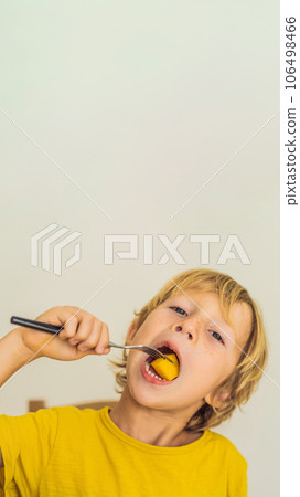 Boy eats fruit. Healthy food for children. Child eating healthy snack. Vegetarian nutrition for kids. Vitamins for children VERTICAL FORMAT for Instagram mobile story or stories size. Mobile wallpaper Boy eats fruit. Healthy food for children. Child eating healthy snack. Vegetarian nutrition for kids. Vitamins for children VERTICAL FORMAT for Instagram mobile story or stories size. Mobile wallpaper 106498466