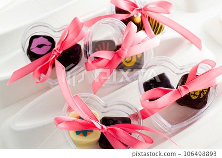 Miniature hear shaped boxes filled with gourmet truffles. Miniature hear shaped boxes filled with gourmet truffles. 106498893