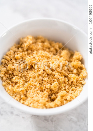 Freshly dried bread crumbs in a white bowl. 106498992