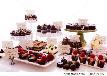 Dessert bar with assorted chocolate sweets. 106499497