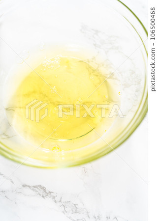 Separating egg whites and yolks to bake meringue cookies. Separating egg whites and yolks to bake meringue cookies. 106500468