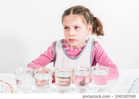 Easter egg coloring. Mixing food coloring with water and a dash of white vinegar to dye Easter eggs. Easter egg coloring. Mixing food coloring with water and a dash of white vinegar to dye Easter eggs. 106500590