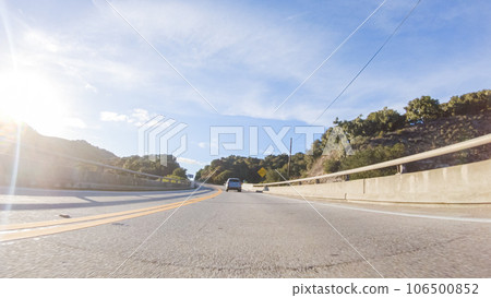 Basking in the beauty of a sunny winter day, driving on HWY 1 near Las Cruces, California offers stunning views of the picturesque coastal landscape against a backdrop of clear blue skies. 106500852