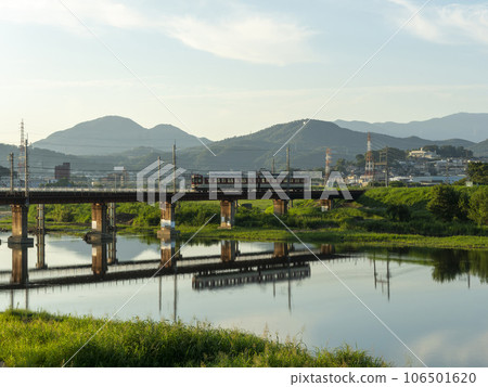 Trains on the Kintetsu Myoji Line crossing the Yamato River early in the morning Trains on the Kintetsu Myoji Line crossing the Yamato River early in the morning 106501620