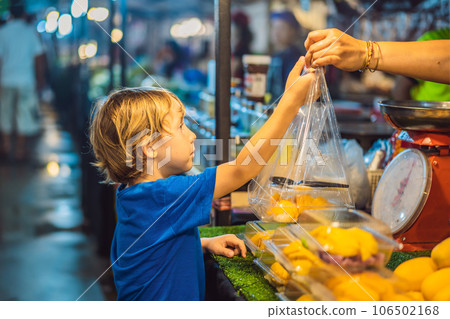 Young boy tourist on Walking street Asian food market Young boy tourist on Walking street Asian food market 106502168