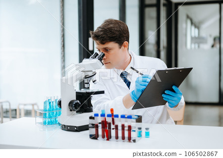Modern medical research laboratory. female scientist working with micro pipettes analyzing biochemical samples, advanced science chemical laboratory . 106502867