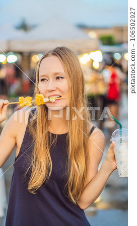 Young woman tourist on Walking street Asian food market VERTICAL FORMAT for Instagram mobile story or stories size. Mobile wallpaper 106502927