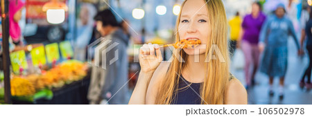 Young woman tourist on Walking street Asian food market BANNER, LONG FORMAT 106502978