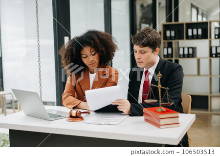 business people and lawyers discussing contract papers sitting at the table. Concepts of law, advice, legal services. in morning light. business people and lawyers discussing contract papers sitting at the table. Concepts of law, advice, legal services. in morning light. 106503513