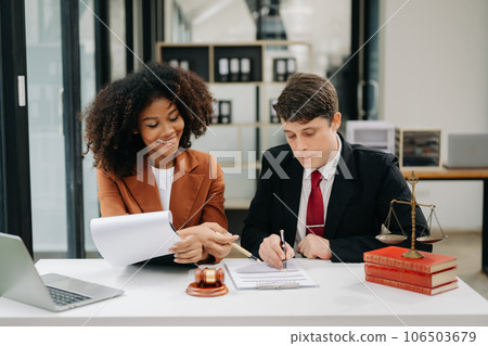 business people and lawyers discussing contract papers sitting at the table. Concepts of law, advice, legal services. in morning light. business people and lawyers discussing contract papers sitting at the table. Concepts of law, advice, legal services. in morning light. 106503679