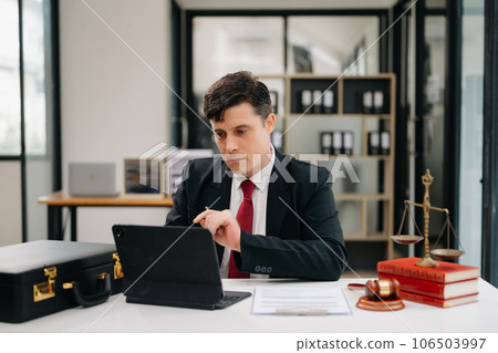 Mature man lawyer working and gavel, tablet, laptop in front, Advice justice and law concept. at office. Mature man lawyer working and gavel, tablet, laptop in front, Advice justice and law concept. at office. 106503997
