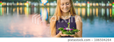 Young woman celebrates Loy Krathong, Runs on the water. Loy Krathong festival, People buy flowers and candle to light and float on water to celebrate the Loy Krathong festival in Thailand BANNER, LONG 106504264