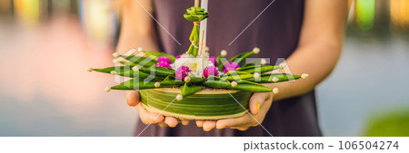 Young woman celebrates Loy Krathong, Runs on the water. Loy Krathong festival, People buy flowers and candle to light and float on water to celebrate the Loy Krathong festival in Thailand BANNER, LONG Young woman celebrates Loy Krathong, Runs on the water. Loy Krathong festival, People buy flowers and candle to light and float on water to celebrate the Loy Krathong festival in Thailand BANNER, LONG 106504274