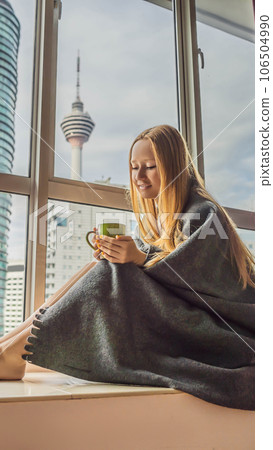 Woman wrapped in a blanket and looking at the big city VERTICAL FORMAT for Instagram mobile story or stories size. Mobile wallpaper Woman wrapped in a blanket and looking at the big city VERTICAL FORMAT for Instagram mobile story or stories size. Mobile wallpaper 106504990
