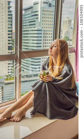 Woman wrapped in a blanket and looking at the big city VERTICAL FORMAT for Instagram mobile story or stories size. Mobile wallpaper Woman wrapped in a blanket and looking at the big city VERTICAL FORMAT for Instagram mobile story or stories size. Mobile wallpaper 106504995