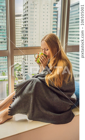 Woman wrapped in a blanket and looking at the big city VERTICAL FORMAT for Instagram mobile story or stories size. Mobile wallpaper Woman wrapped in a blanket and looking at the big city VERTICAL FORMAT for Instagram mobile story or stories size. Mobile wallpaper 106505001