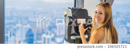 Woman looks at Kuala lumpur cityscape. Panoramic view of Kuala Lumpur city skyline evening at sunset skyscrapers building in Malaysia BANNER, LONG FORMAT Woman looks at Kuala lumpur cityscape. Panoramic view of Kuala Lumpur city skyline evening at sunset skyscrapers building in Malaysia BANNER, LONG FORMAT 106505721