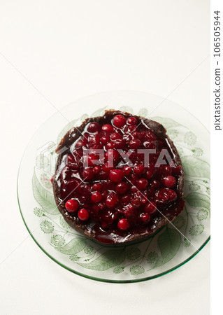 Delicious chocolate dessert with berry jam Delicious chocolate dessert with berry jam 106505944