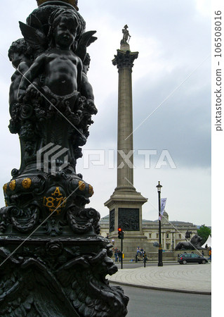 Lamp post and the Nelson's Column at Trafalgar Square in London Lamp post and the Nelson's Column at Trafalgar Square in London 106508016