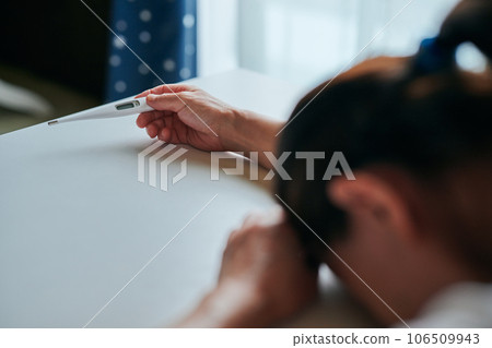 Senior woman falling down with a thermometer 106509943