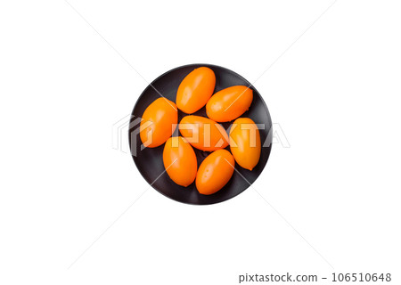 Bright juicy fresh yellow plum-shaped tomatoes. Preparing the tomato sauce Bright juicy fresh yellow plum-shaped tomatoes. Preparing the tomato sauce 106510648