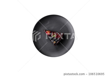 Delicious sweet chocolate brownie cake with blueberries, currants and raspberries Delicious sweet chocolate brownie cake with blueberries, currants and raspberries 106510695