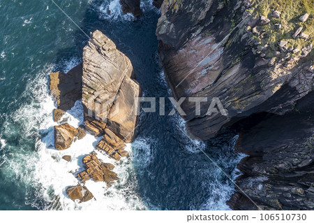 Aerial view of cliffs and sea stacks on Owey Island, County Donegal, Ireland 106510730