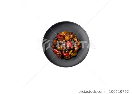 Delicious juicy fresh salad of baked eggplant, tomatoes, sweet peppers, sesame seeds Delicious juicy fresh salad of baked eggplant, tomatoes, sweet peppers, sesame seeds 106510762