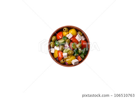 Delicious fresh, juicy Greek salad with feta cheese, olives, tomatoes, cucumber 106510763