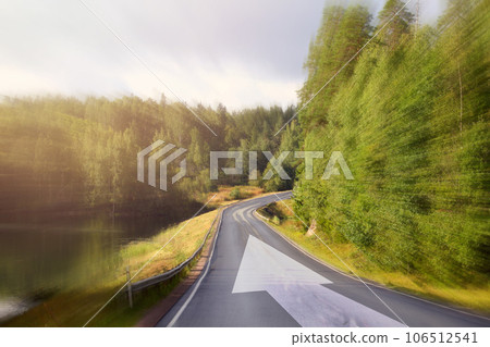 Movement and drive concept, landscape with road and arrow Movement and drive concept, landscape with road and arrow 106512541