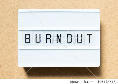 Lightbox with word burnout on wood background Lightbox with word burnout on wood background 106512737
