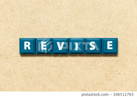 Tile alphabet letter in word revise on wood background 106512765