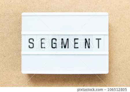 Lightbox with word segment on wood background 106512805