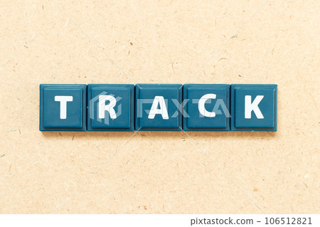 Tile alphabet letter in word track on wood background Tile alphabet letter in word track on wood background 106512821