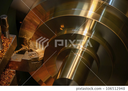Closeup scene the lathe machine finish cut the brass parts by lathe tools. Closeup scene the lathe machine finish cut the brass parts by lathe tools. 106512948