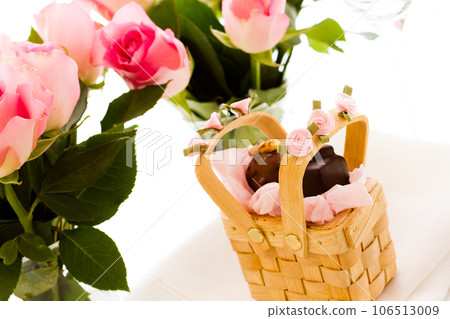 Miniature picnic baskets favor boxes filled with truffles. 106513009