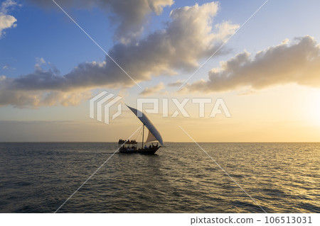 Tourist boat at sunset and background clouds Tourist boat at sunset and background clouds 106513031