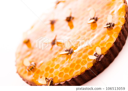 White chocolate lemon honey tart on a white background. White chocolate lemon honey tart on a white background. 106513059