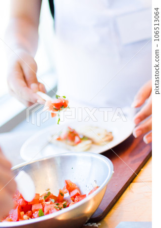 Kinds in cooking class making bruschetta. Kinds in cooking class making bruschetta. 106513064
