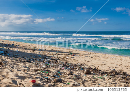 Tropical beach and plastical trash in Bali island. Pollution by plastic rubbish on coastline 106513765
