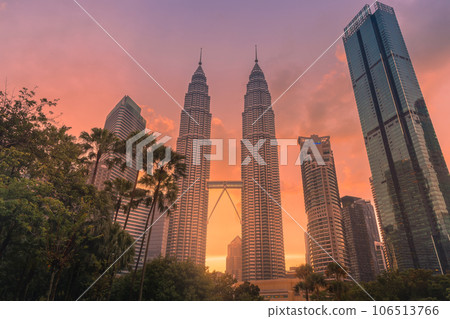 July 30, 2022. Kuala Lumpur, Malaysia. Petronas skyscrapers with sunset tones. Twin towers in KL center and sunset. July 30, 2022. Kuala Lumpur, Malaysia. Petronas skyscrapers with sunset tones. Twin towers in KL center and sunset. 106513766