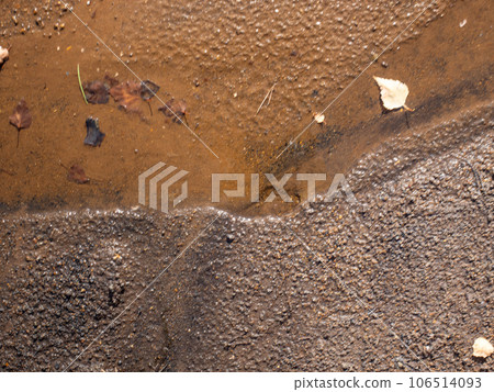 Rusty sand on the beach of colapsed coal mine. Geological park 106514093
