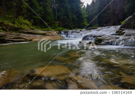 Photo of a mountain river with stones. 106514169