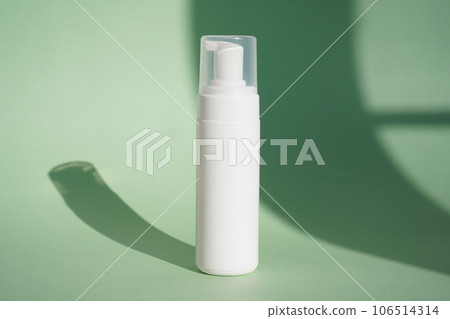 Empty white packaging tube for beauty spa, medical skin care and cosmetic lotion cream packaging, face wash foam, product design layout on green background Empty white packaging tube for beauty spa, medical skin care and cosmetic lotion cream packaging, face wash foam, product design layout on green background 106514314