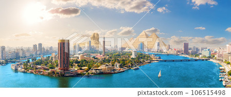 Modern Cairo downtown, aerial view over the Nile on the way to the pyramids of Egypt Modern Cairo downtown, aerial view over the Nile on the way to the pyramids of Egypt 106515498