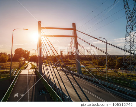 modern metal cable bridge over Bystrzyca river, sunset, Zeglarska street, Lublin modern metal cable bridge over Bystrzyca river, sunset, Zeglarska street, Lublin 106515745