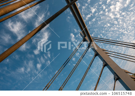 modern metal cable bridge on blue sky background at sunset, Lublin modern metal cable bridge on blue sky background at sunset, Lublin 106515748