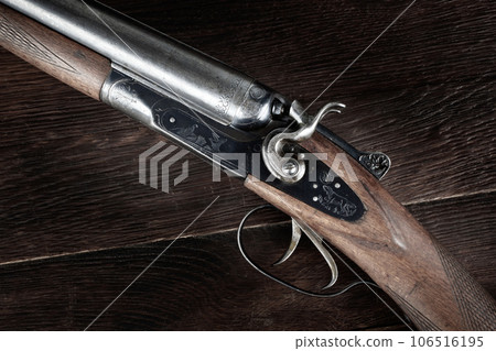 Antique 12-gauge break-action smooth-bored shotgun. Antique 12-gauge break-action smooth-bored shotgun. 106516195